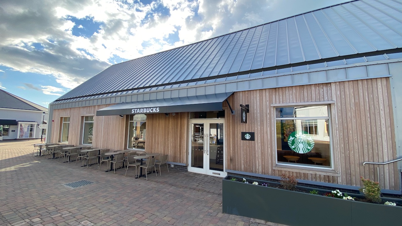 Single story wooden building with outdoor seating